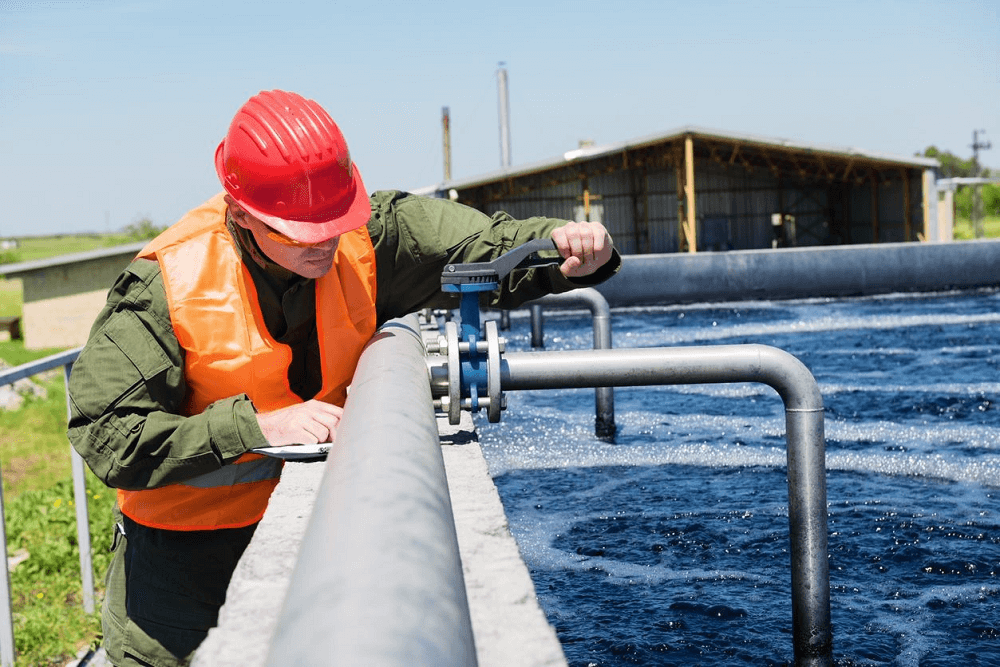 worker checking on APG sensor as part of a data acquisition system. DAQ